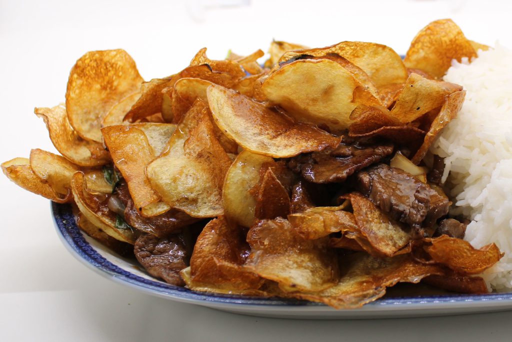 Fried potato slices stir-fried with flank steak, onions, and garlic. Topped with spring onions and served with jasmine rice. Can be made vegan with mock duck. — With Thai fried egg add $1.00.