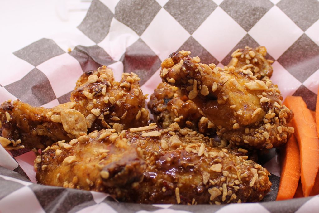 Deep-fried chicken wings caramelized in fish sauce and sugar. Tossed with crispy garlic and chili crisp.